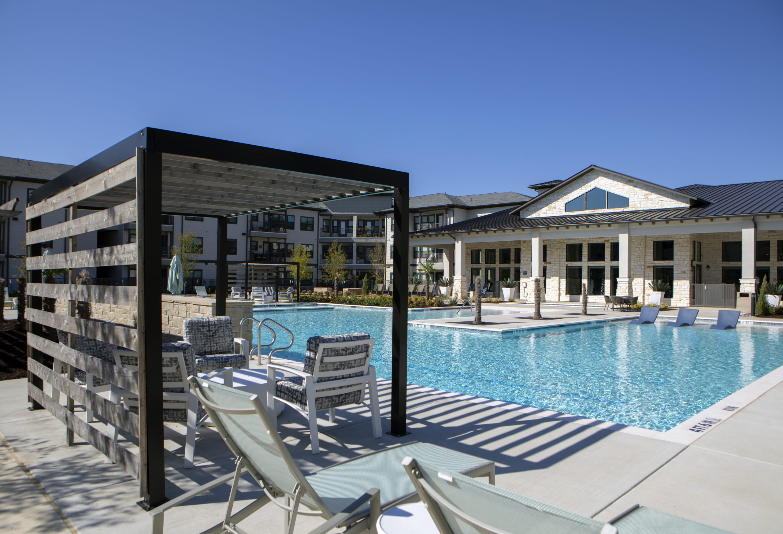 Resort style pool with sun deck at Solea Keller Apartments in Fort Worth Texas